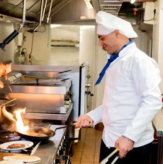 Desert Springs Chef Created Meals, chef frying a dish.
