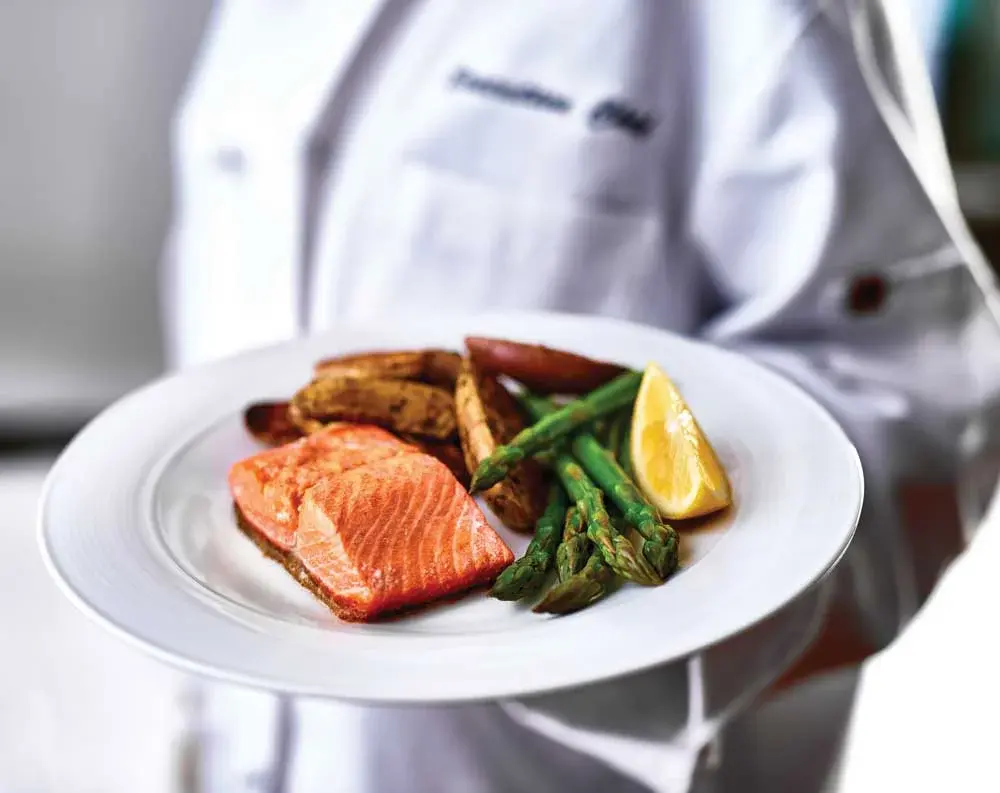 Desert Springs Chef Created Meals, chef delivering a finished dish.