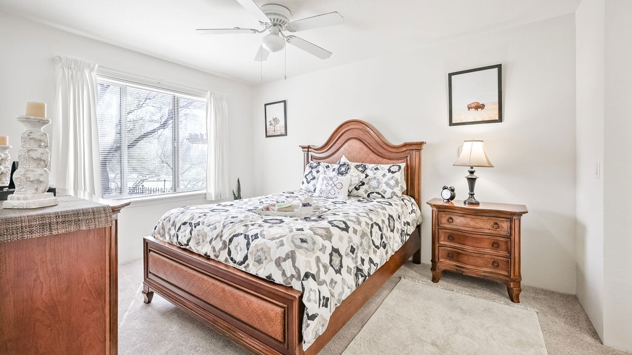 A furnished bedroom in a Desert Springs apartment